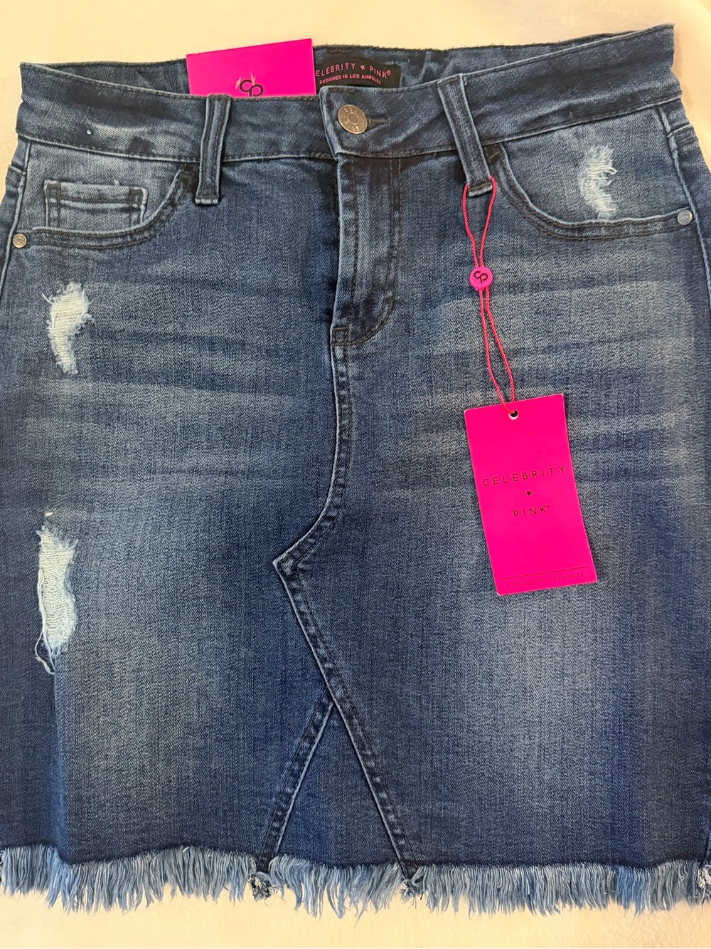 Celebrity Pink Distressed Blue Denim Mini Skirt with Fringe Hem